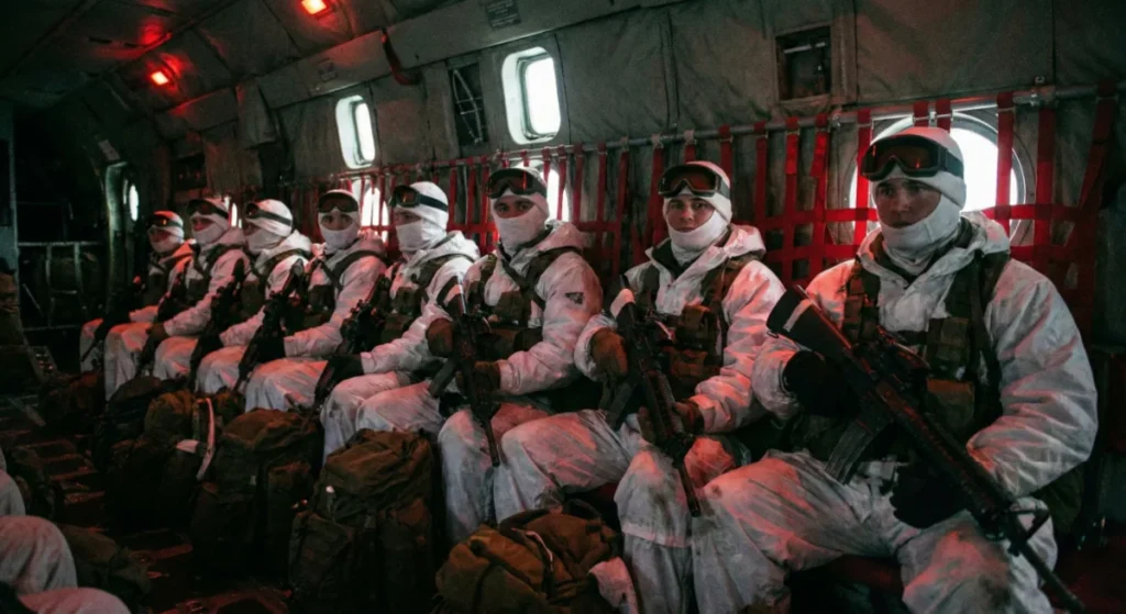 Heavily armed US special forces soldiers inside a transport plane for a secret mission